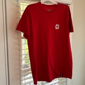 Selling a adidas shirt ,size medium, red still bright in color